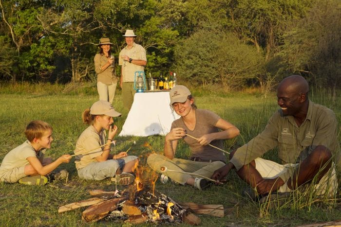 Young explorers family safari campfire